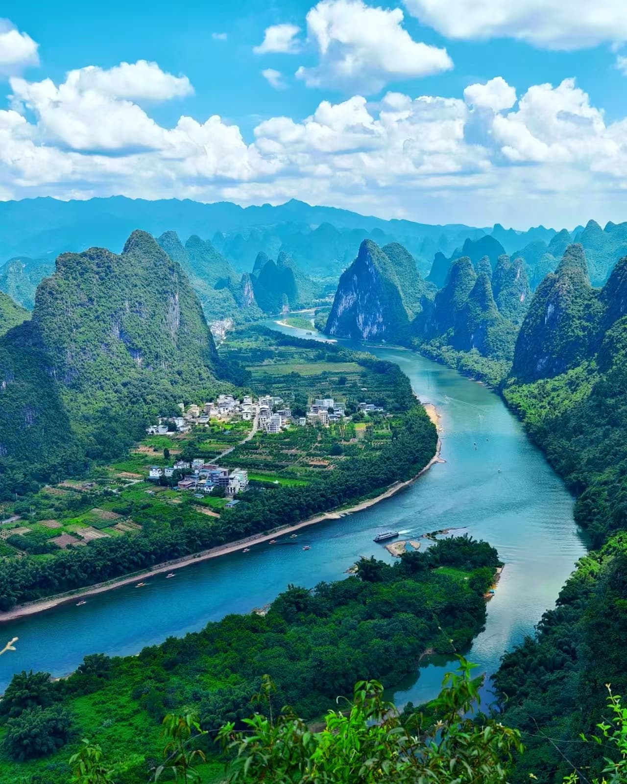 Guilin karst peaks and river — expansive landscape, no people in frame